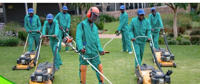 Blue Star groundskeeping crew with lawnmowers and brushcutters